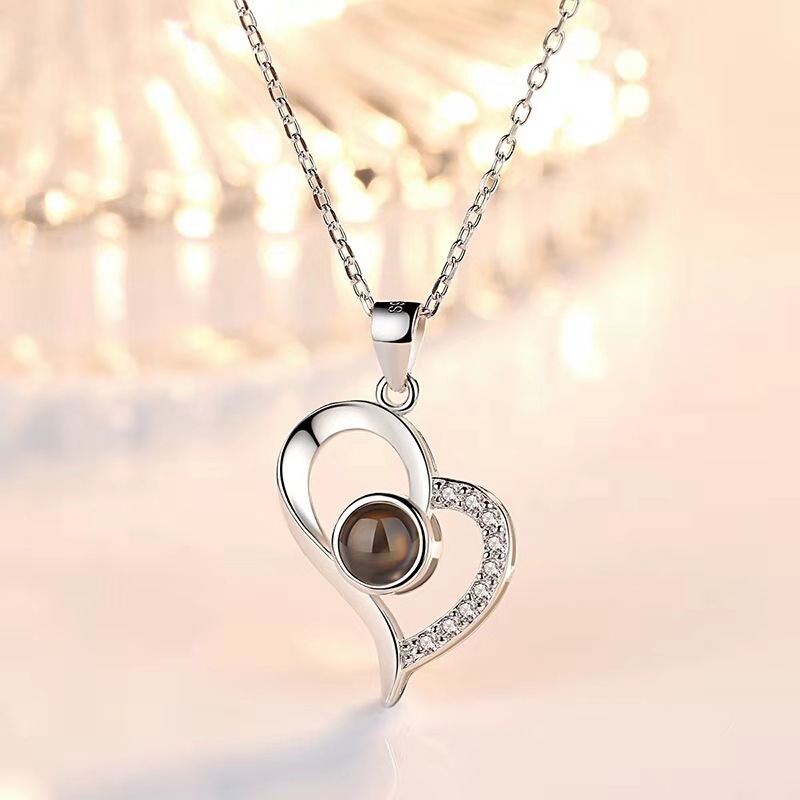 This unique necklace features a romantic message that can be read in 100 different languages, allowing the wearer to express their love in a truly special way. It is made of premium-grade materials and is hypoallergenic, making it a safe and luxurious gift for the special someone in your life.