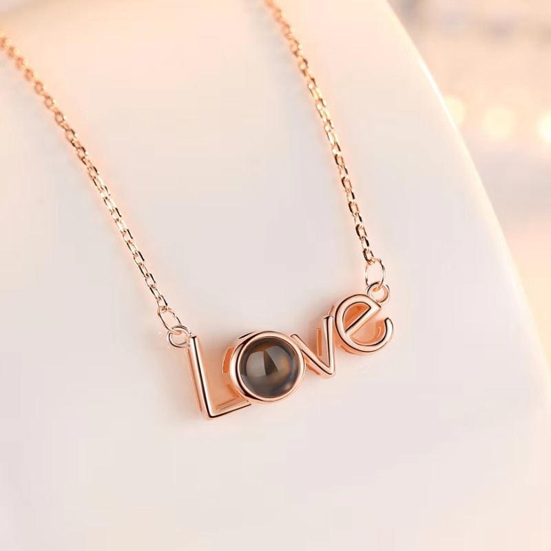 This unique necklace features a romantic message that can be read in 100 different languages, allowing the wearer to express their love in a truly special way. It is made of premium-grade materials and is hypoallergenic, making it a safe and luxurious gift for the special someone in your life.