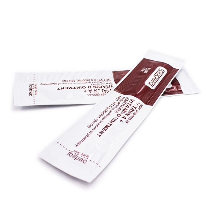 Multiple sachets stacked and opened showing tear-open design and interior cream application
