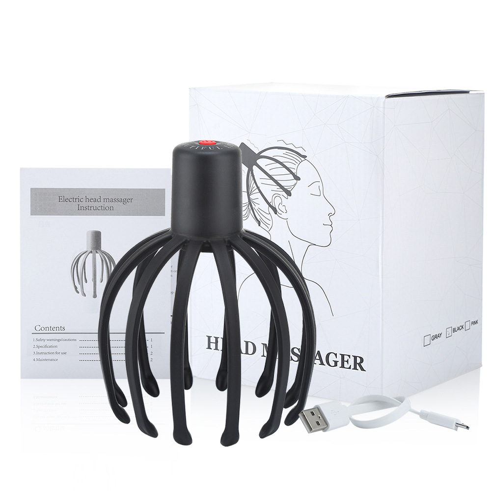Eight-claw electric scalp massager on white pebbled leather with dried palm fronds, soft morning light