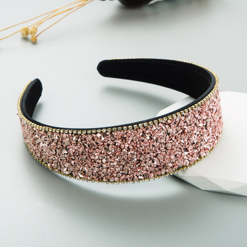 Rose pink headband with black lining and gold edge