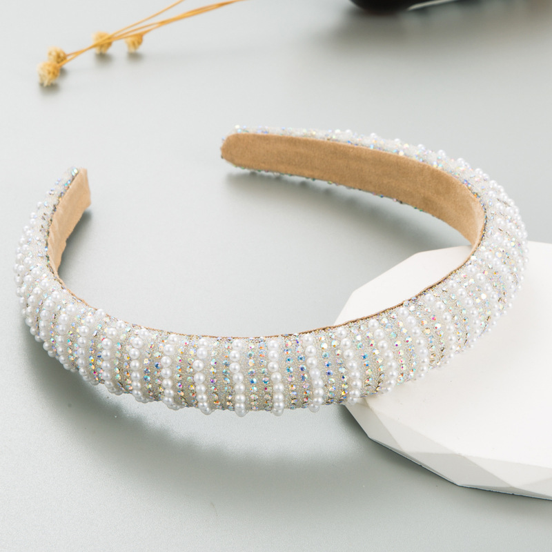 Wide structured padded pearl headband silhouette