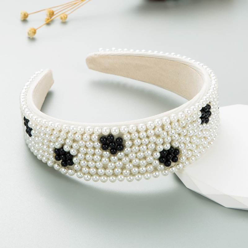 Close view of floral bead pattern and soft inner lining
