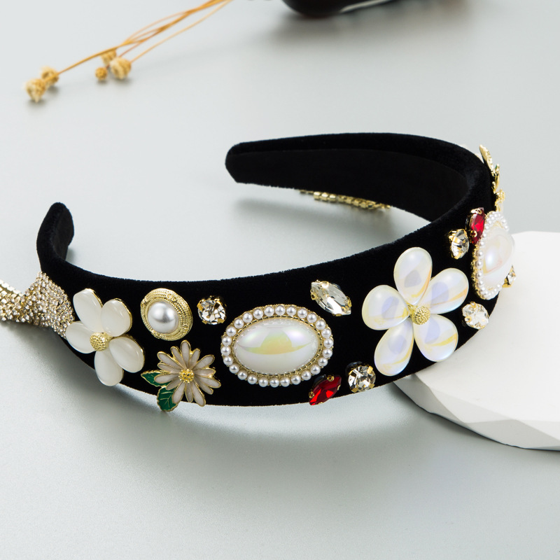 Black baroque headband with cascading gold-tone tassels