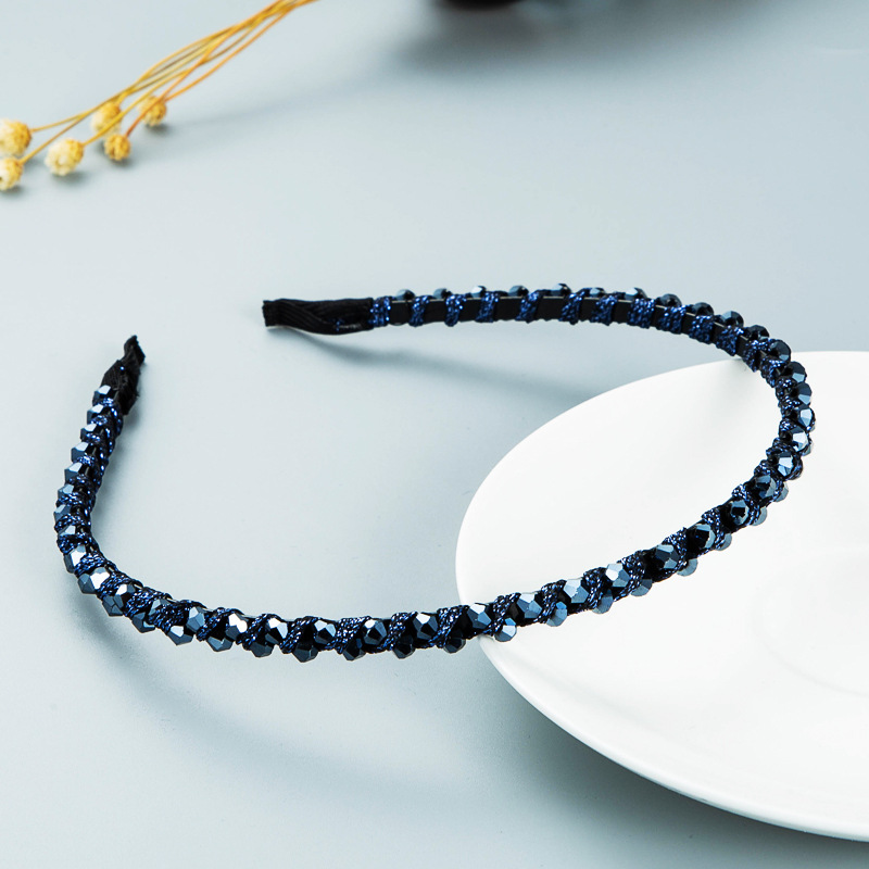 Navy blue headband with narrow crystal-covered band