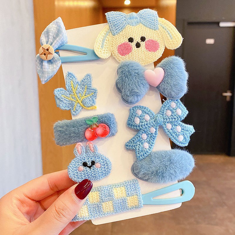 Blue plush hair accessories with embroidered details