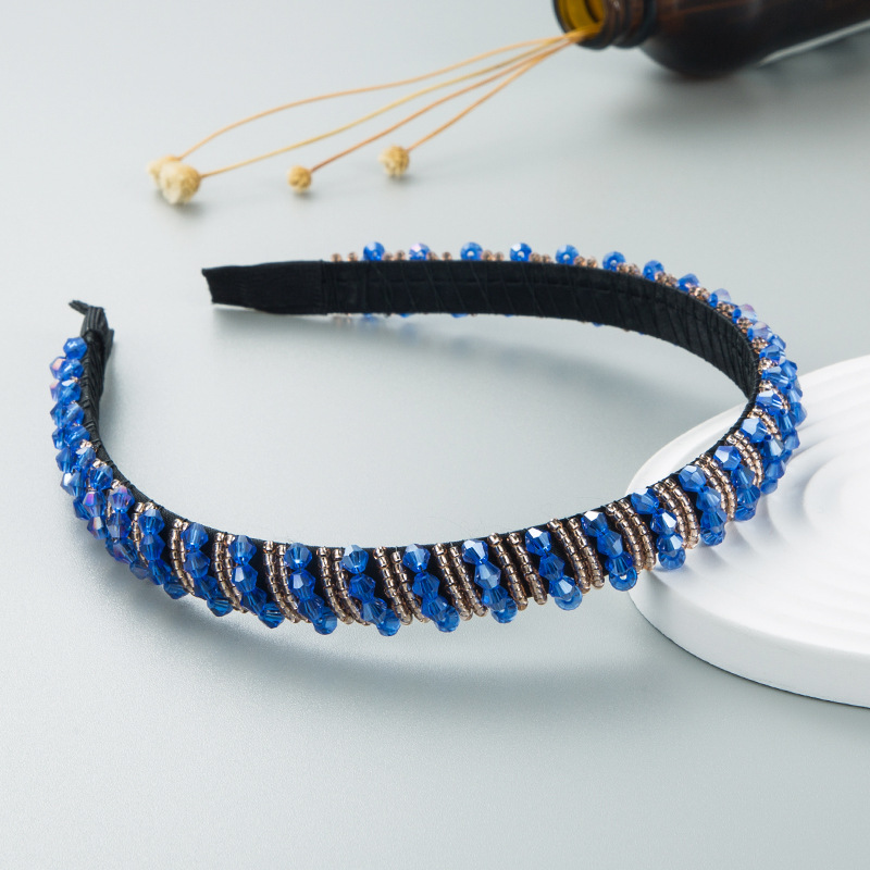 Blue and black beads with repeating woven loops