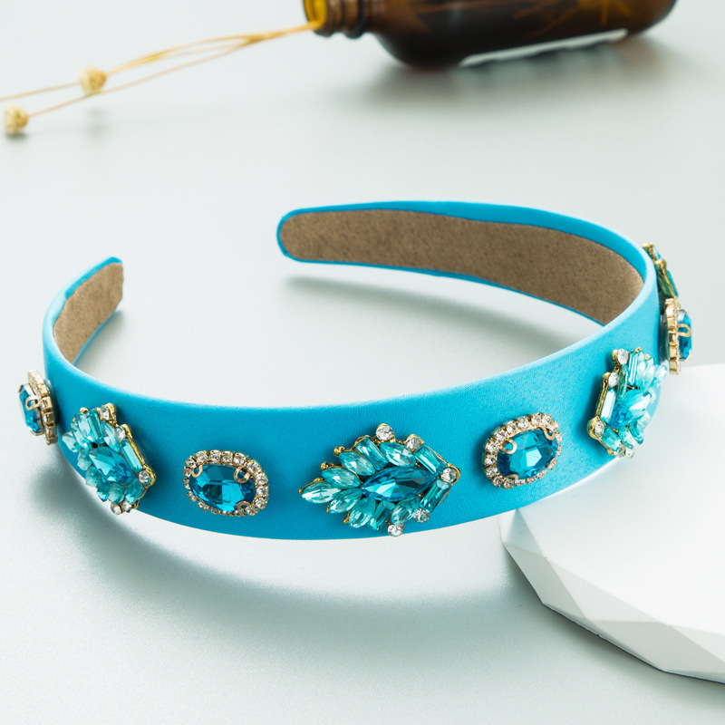 Turquoise headband showing padded interior and smooth fabric