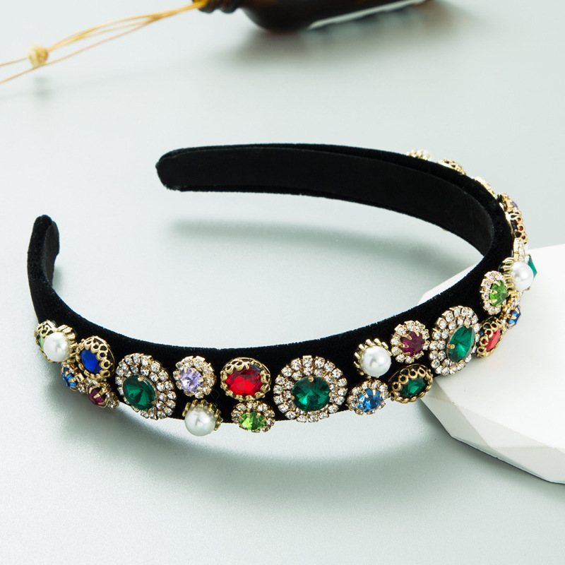 Black velvet headband profile showing curved shape and soft interior