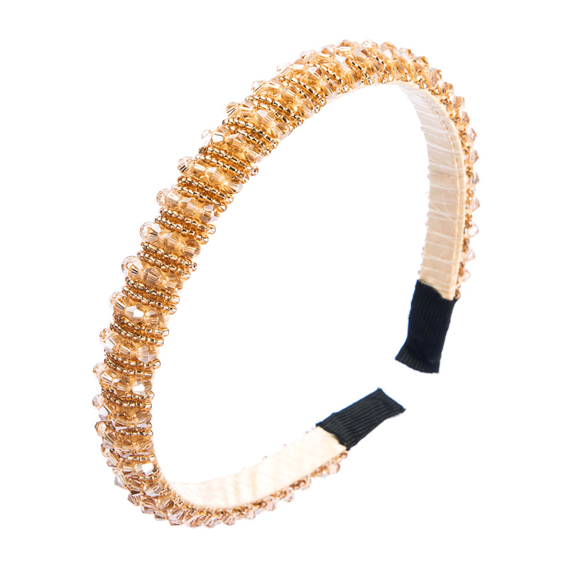 Close view of slim champagne crystal headband