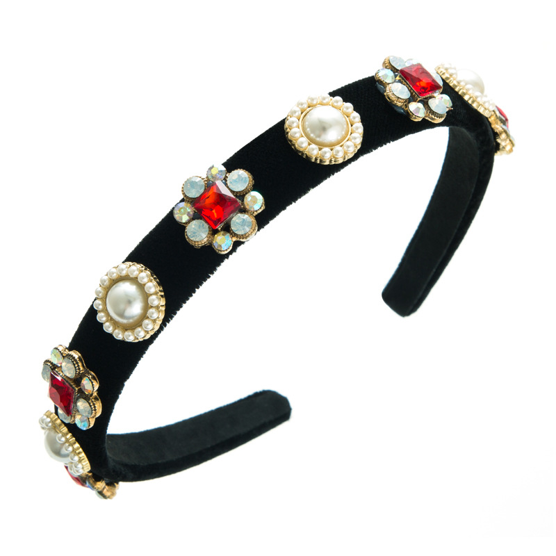Black velvet headband shown from an angled profile