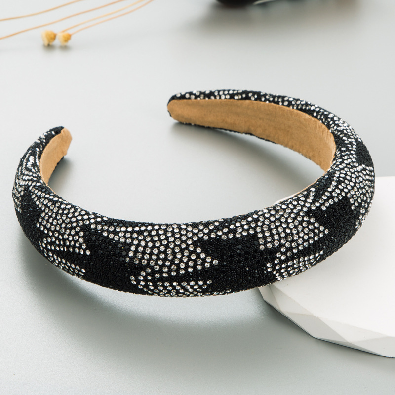 Black headband revealing smooth tan inner lining