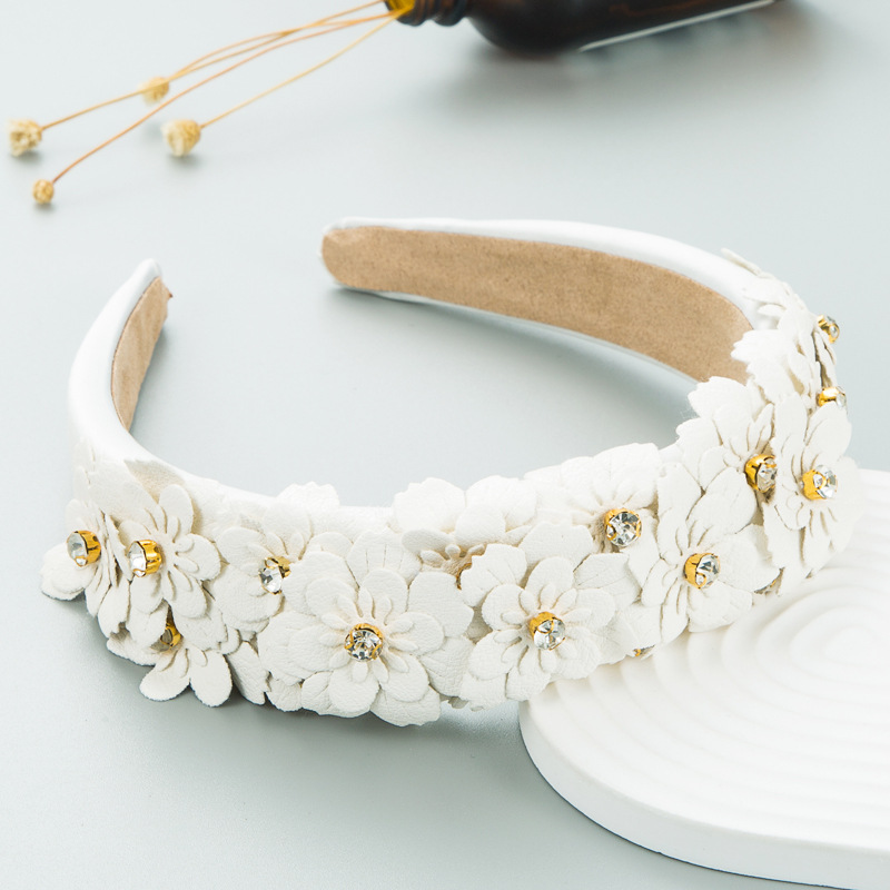 Ivory layered fabric flowers with sparkling rhinestone centers