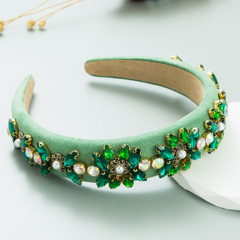 Close view of faceted crystals pearls and gold floral details