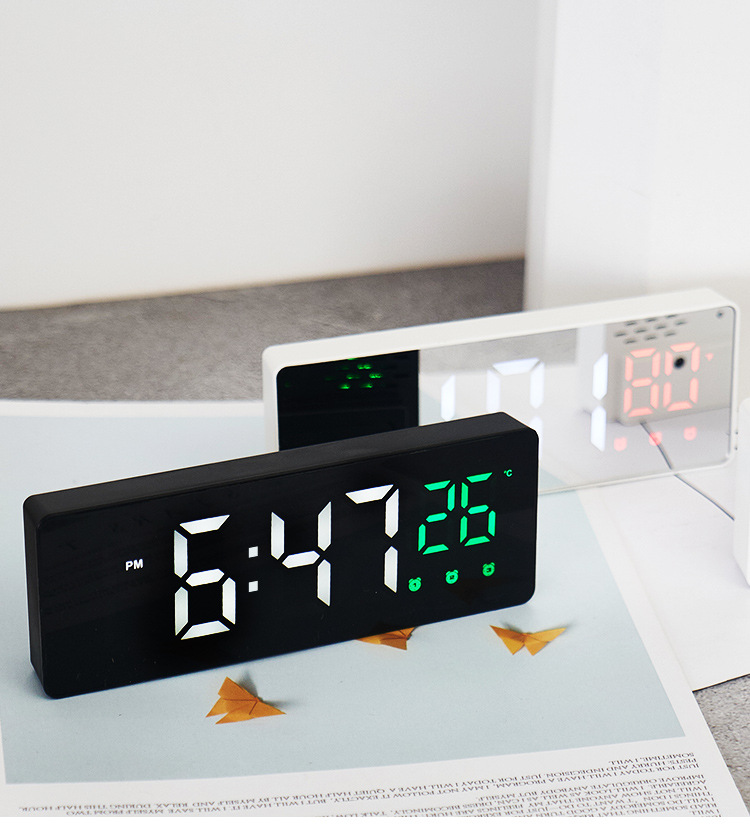 White and Black small electric clock