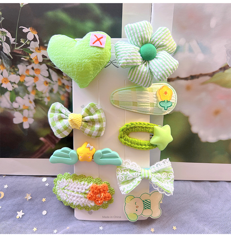 Detailed fabric and plush girls hair clips in bright colors