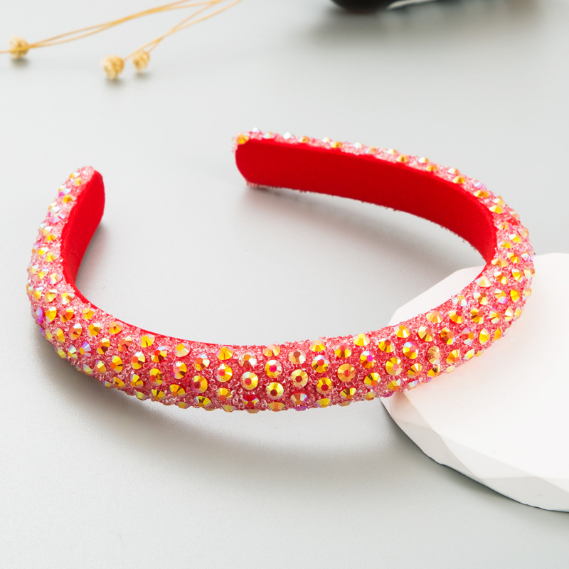 Red rhinestone headband covered in faceted reflective stones