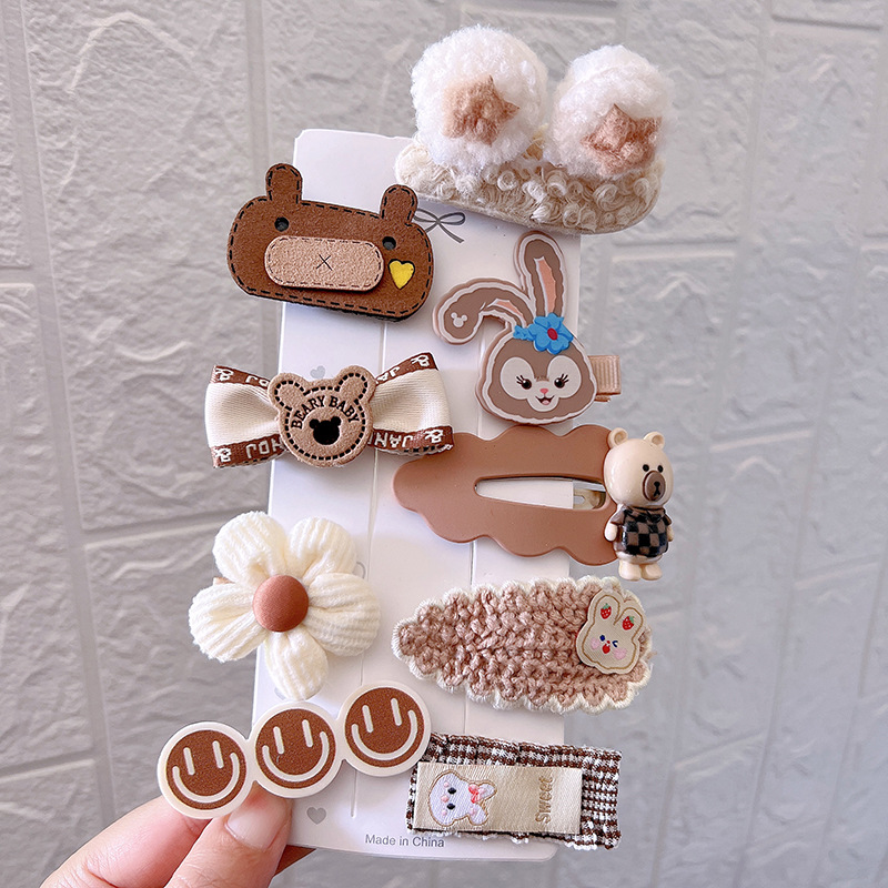 Layered plush embroidered knitted and satin clip details