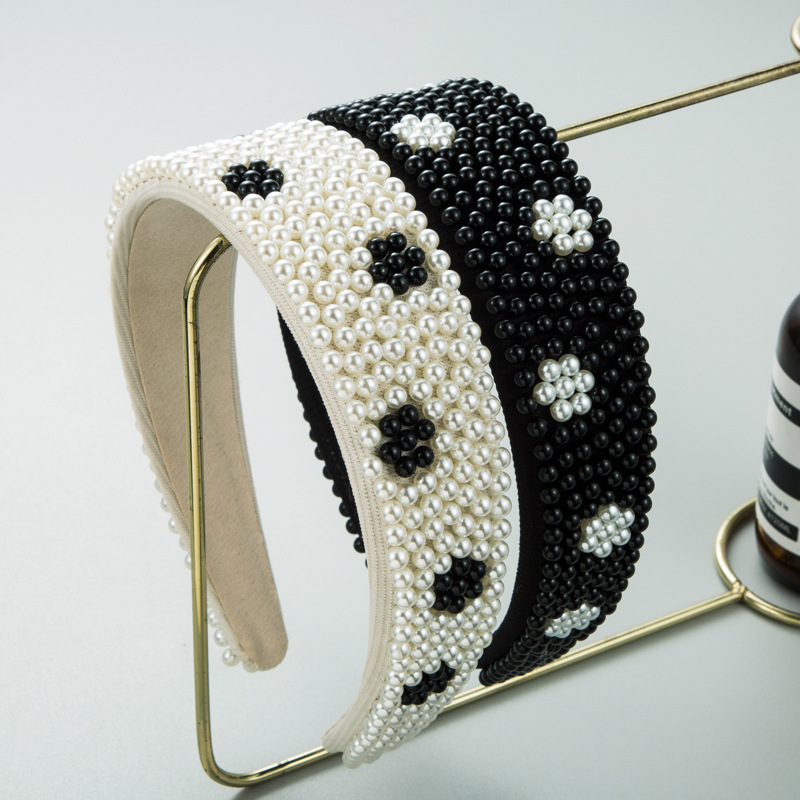 Wide padded headband profile on gold display stand