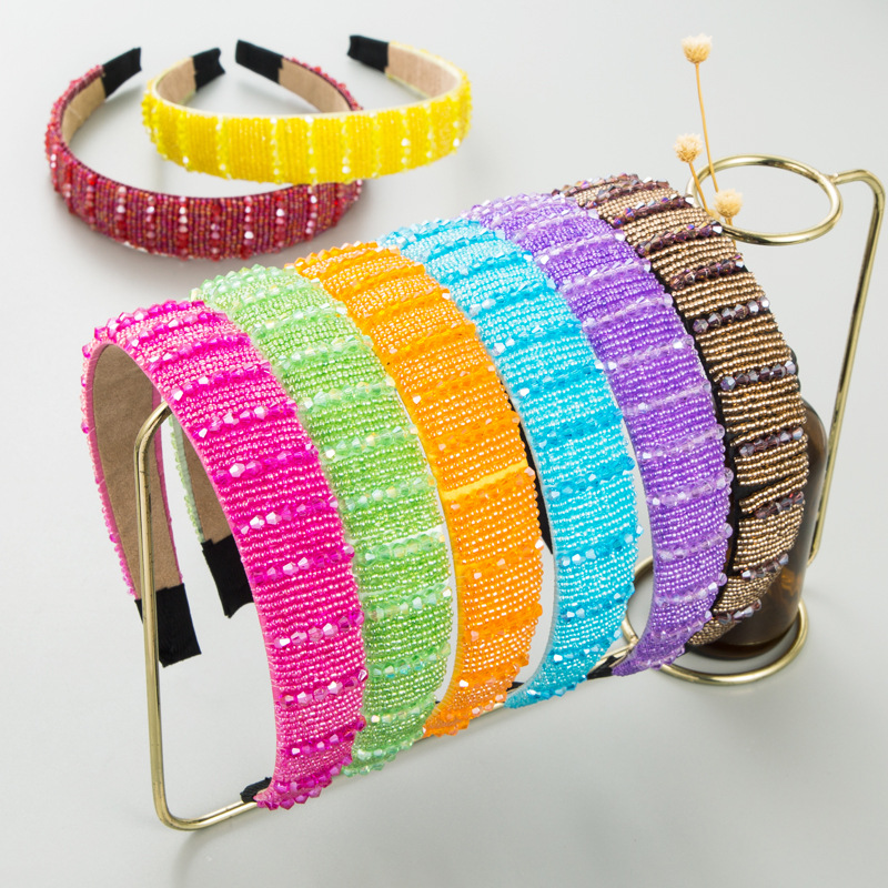 Colorful beaded headbands displayed in bright shades