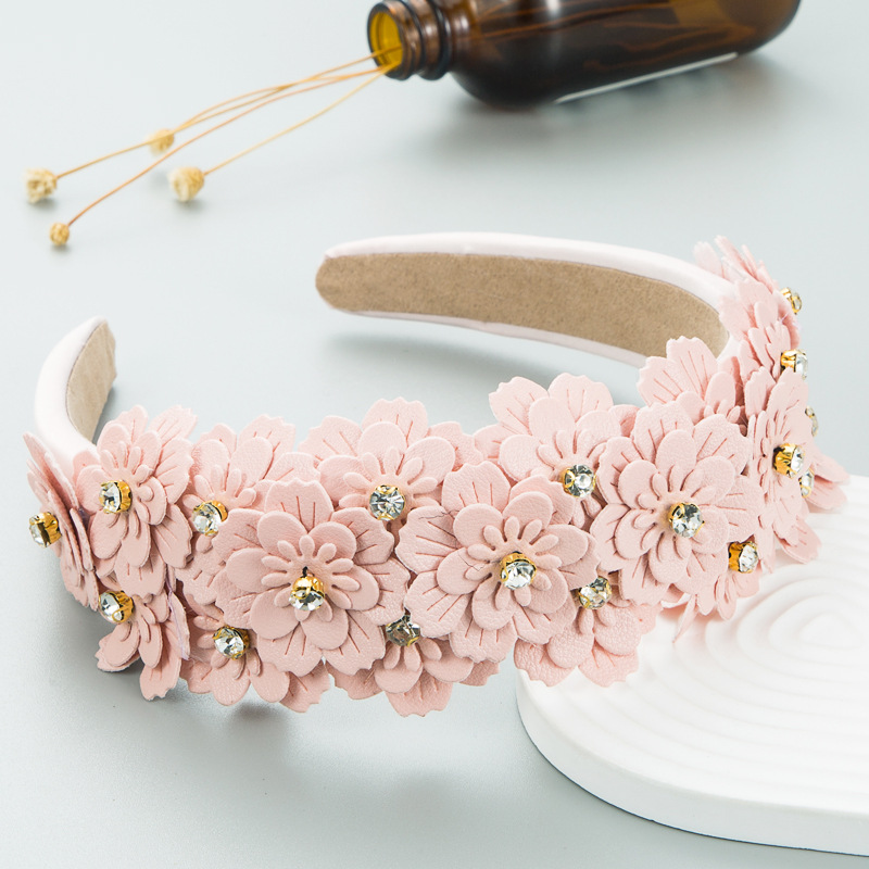 Pink floral headband with rhinestones and padded inner band