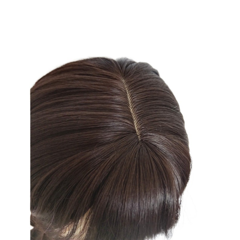 Defined black synthetic strands at wig crown