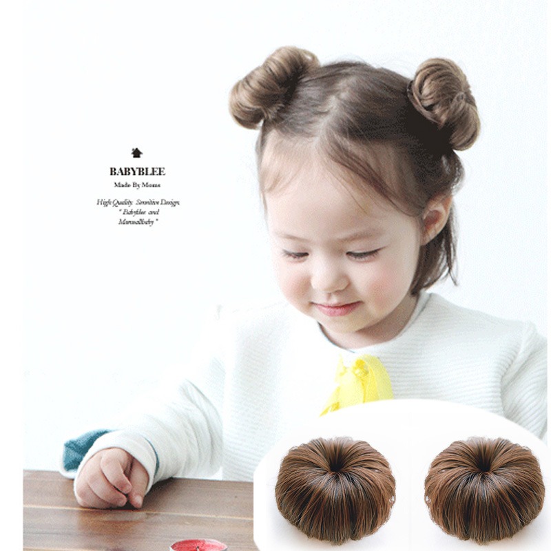 Child wearing coordinated brown bun accessories