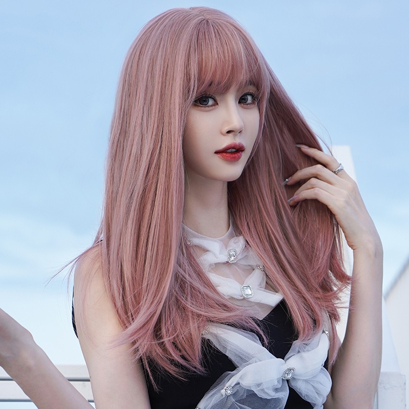 Woman showing volume and movement in pink wig