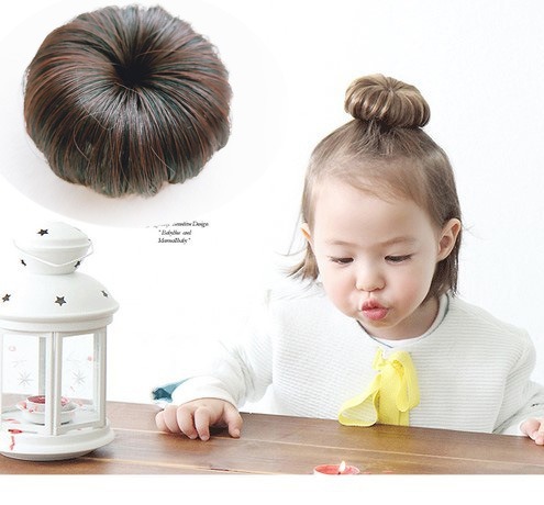 Close-up of rounded brown faux-hair bun