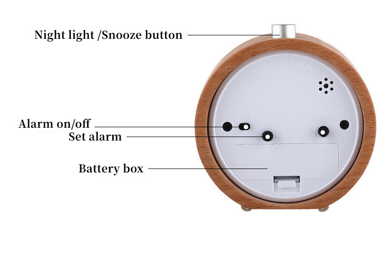 Round wooden alarm clock with labeled buttons displayed.