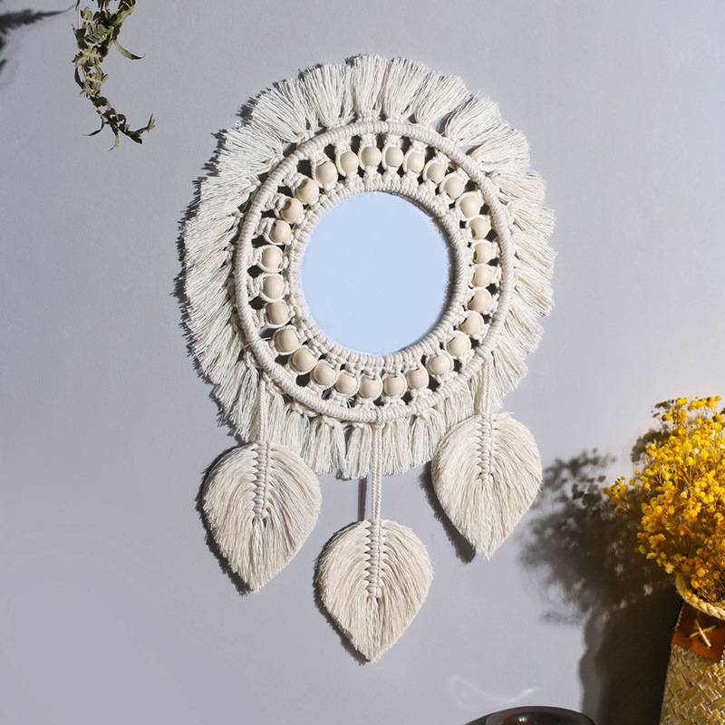 Reflective center framed by cream cotton fringe