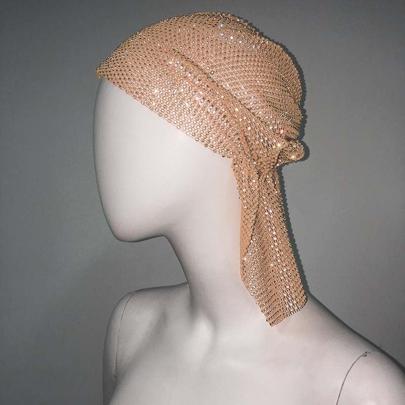 Champagne rhinestone mesh catching light on mannequin