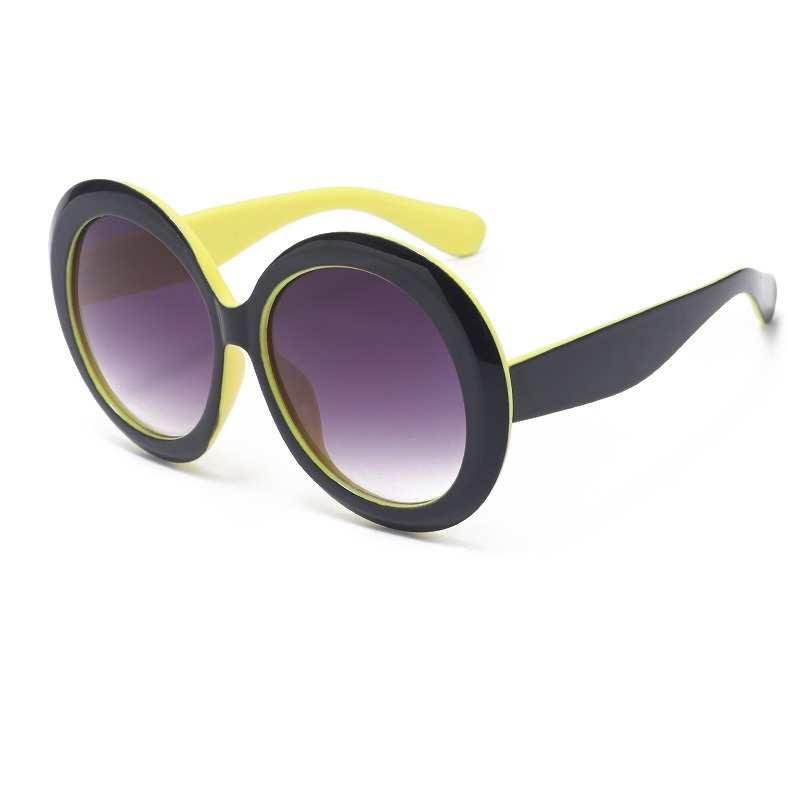Yellow and black circular sunglasses with gradient tinted lenses