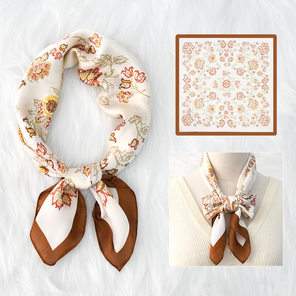 Floral scarf tied around neck over cream knitwear