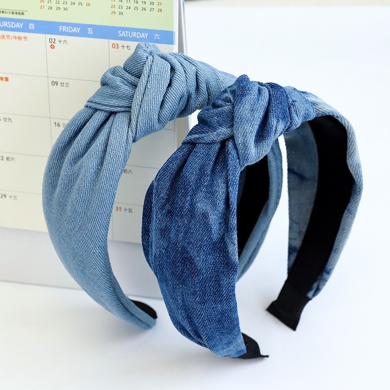 Close view of gathered denim knot texture
