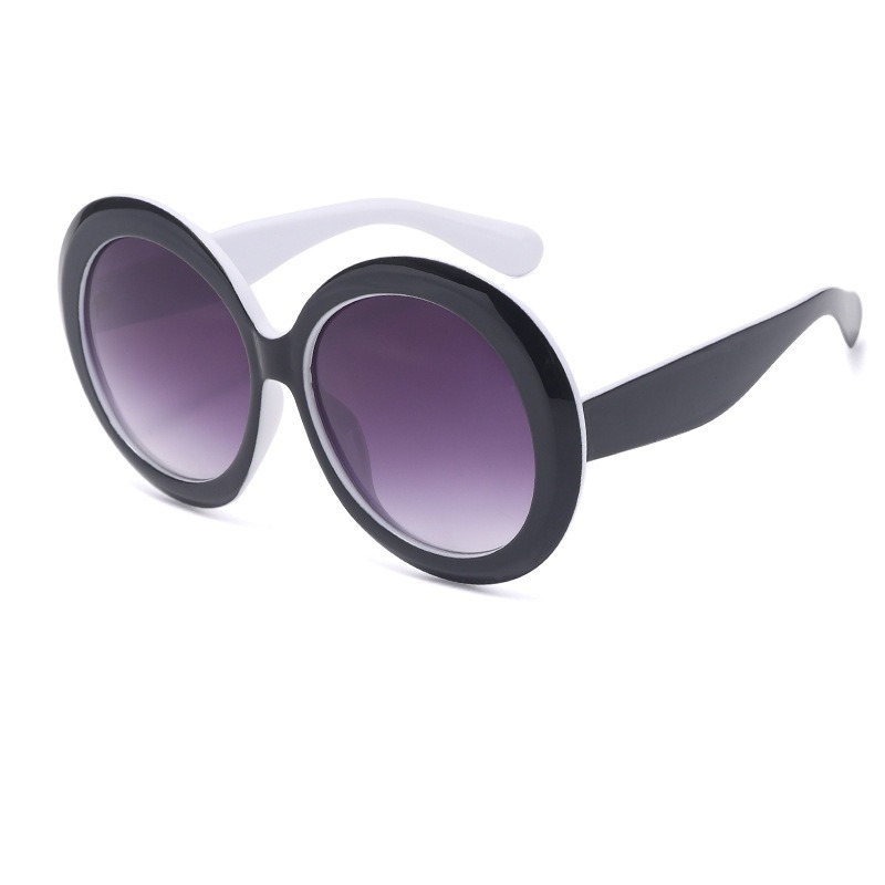 Oversized sunglasses showing sculpted temples and ear tips