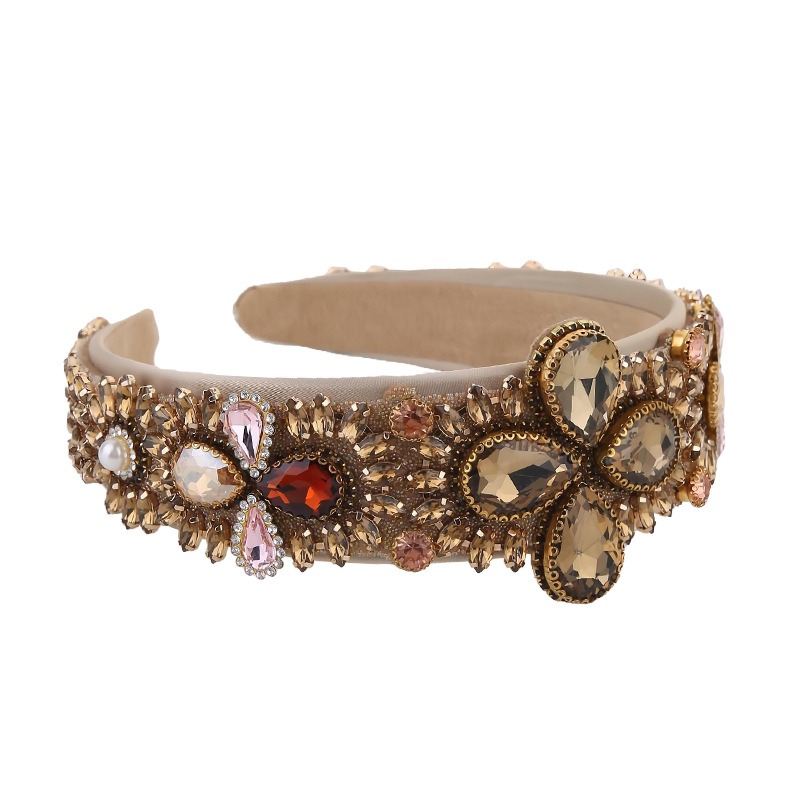 Champagne gold headband showing wide rounded padded silhouette
