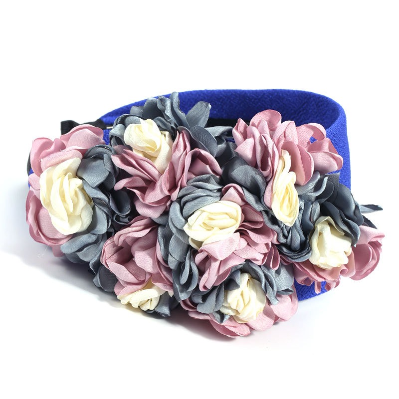Wide blue fabric headband with soft floral appliques