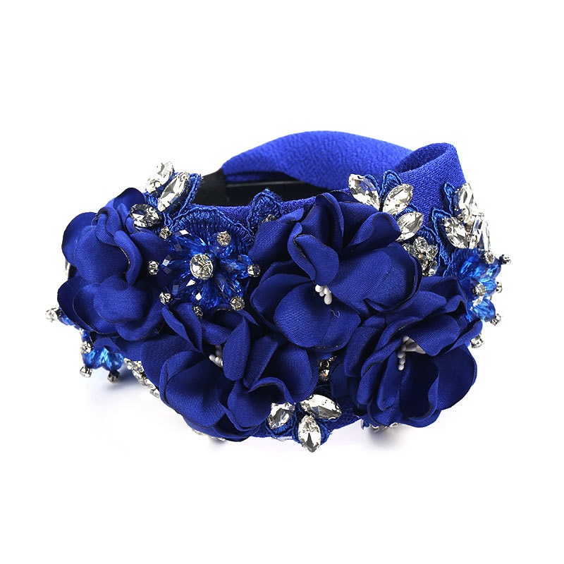 Royal blue headband with dense dimensional floral arrangement