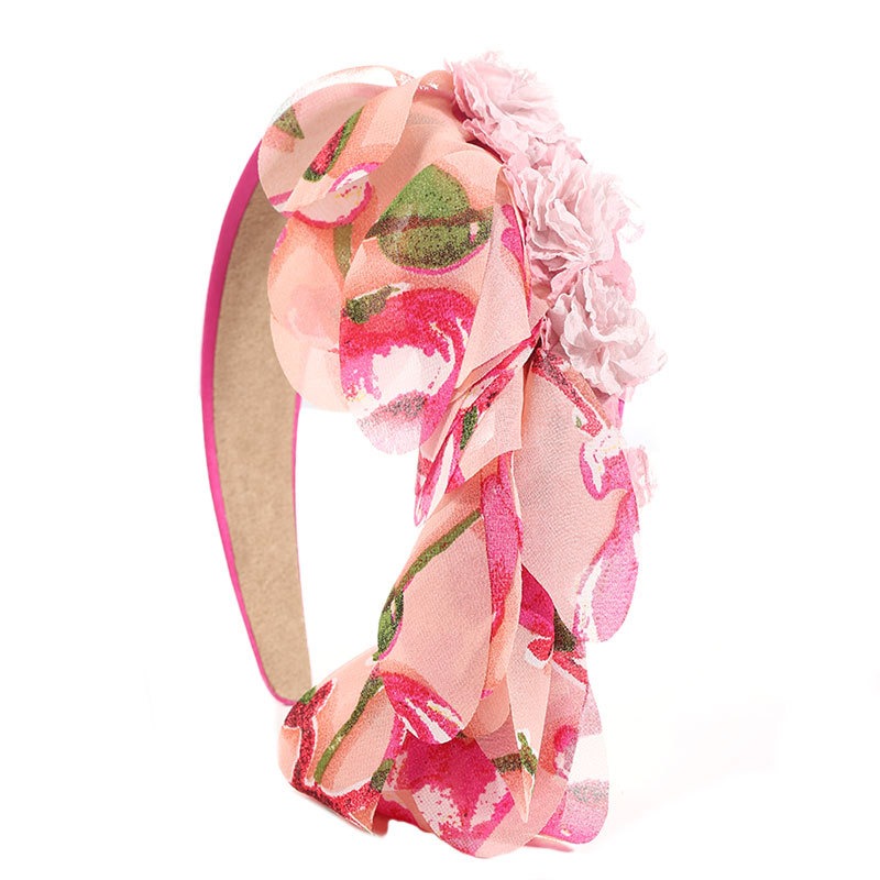 Pink floral headband with layered flowers and fabric volume