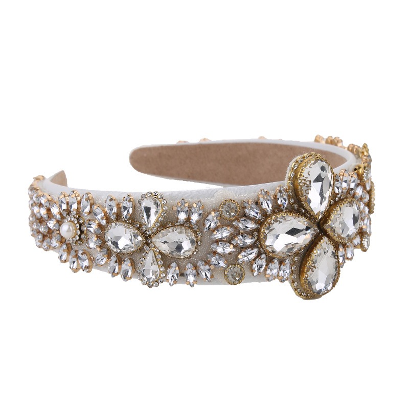 White padded headband displaying reflective faceted crystal arrangement