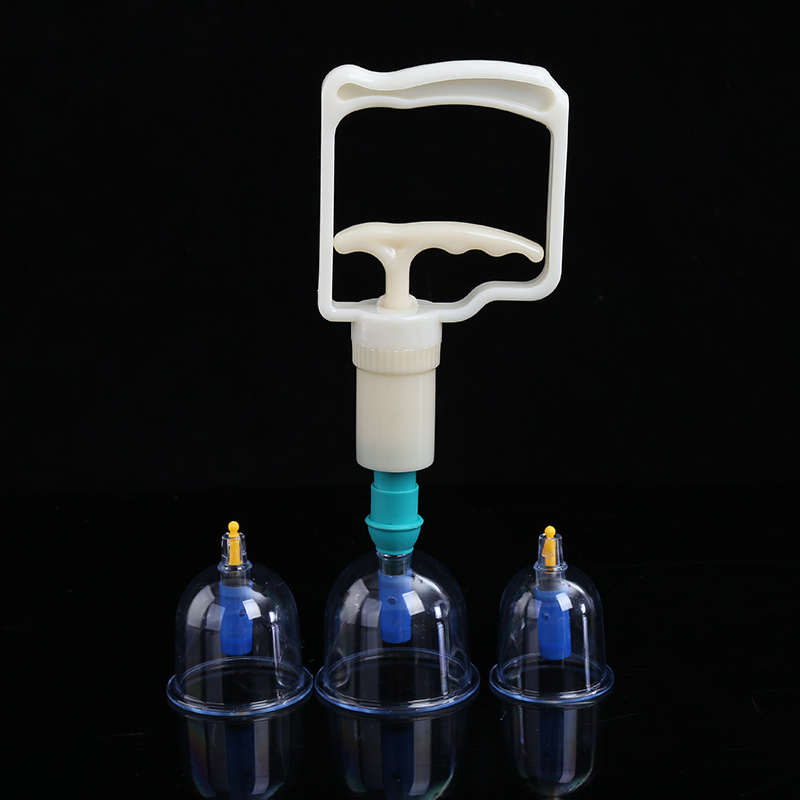 Hand pump apparatus with turquoise tubing connected to three glass cups, demonstrating adjustable suction for targeted therapy