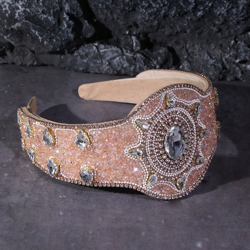 Wide champagne headband showing structured padded construction