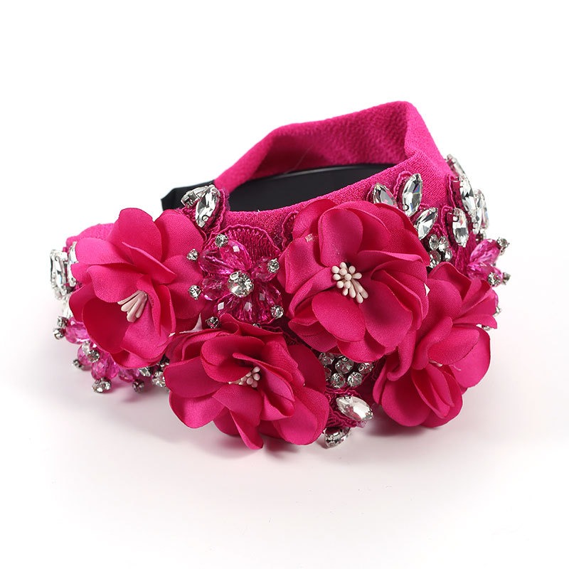 Fuchsia fabric flowers with embroidered texture and crystals