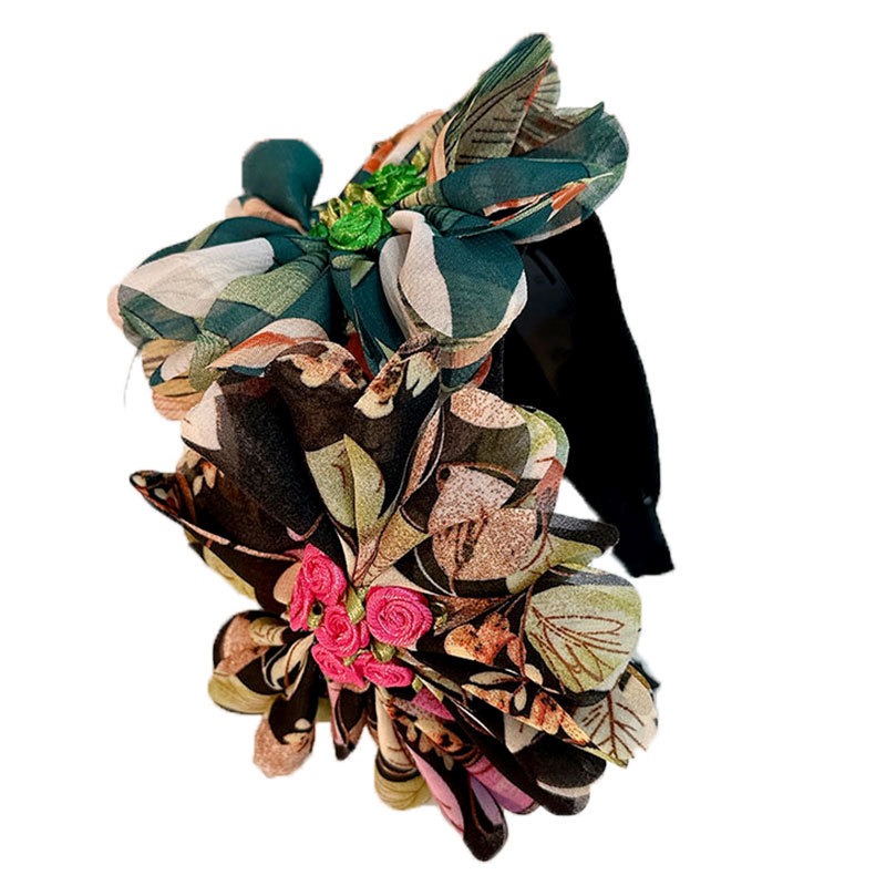 Dark padded band with sculptural cream teal flowers