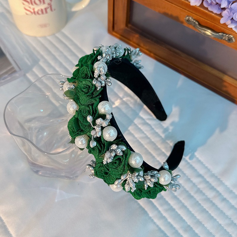 Emerald floral pearl headband showing wide curved band