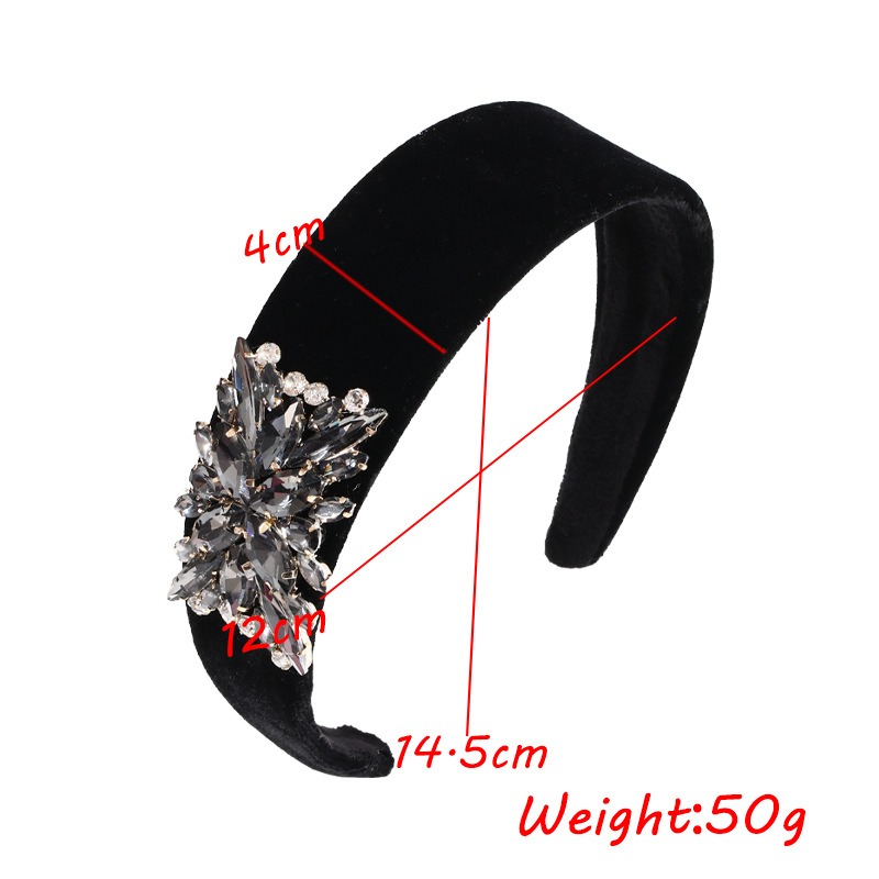Measured black padded headband showing lightweight construction