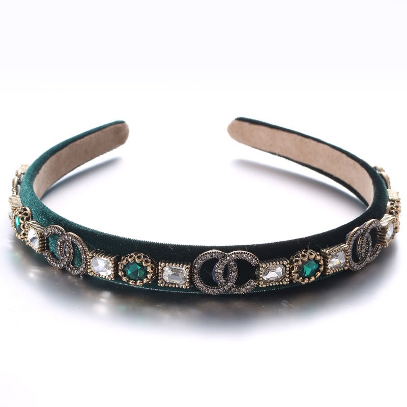 Deep teal headband showing contrasting jewel and crystal accents