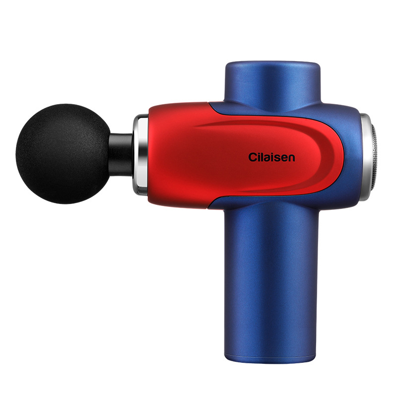 Cilaisen CP-F10 fascia gun in racing red and midnight blue with spherical massage head on warm sand travertine background with eucalyptus sprig