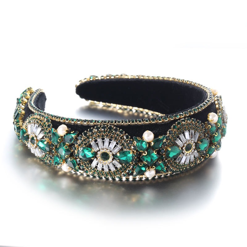 Embellished headband being styled with colorful stones
